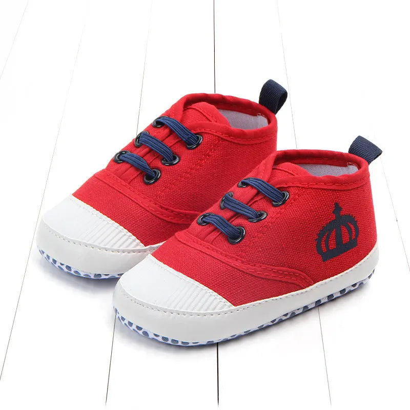 Red and white cotton canvas toddler shoes with elastic band closure in three size options