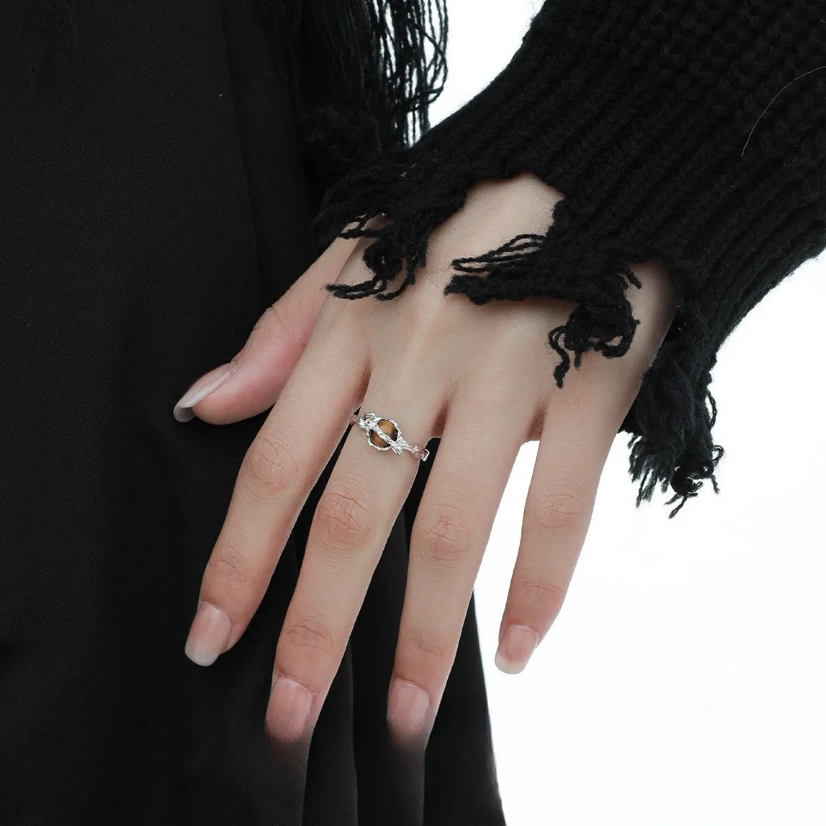 Silver open ring with Saturn design and white gold plating, shown with adjustable opening.