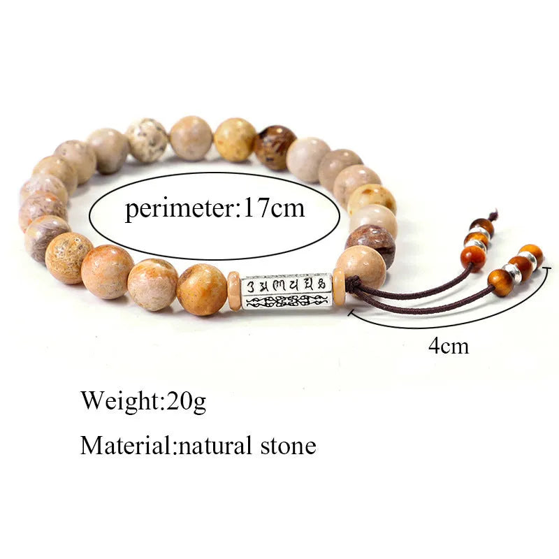 Handmade wood colour stone bead bracelet with adjustable closure on wooden background