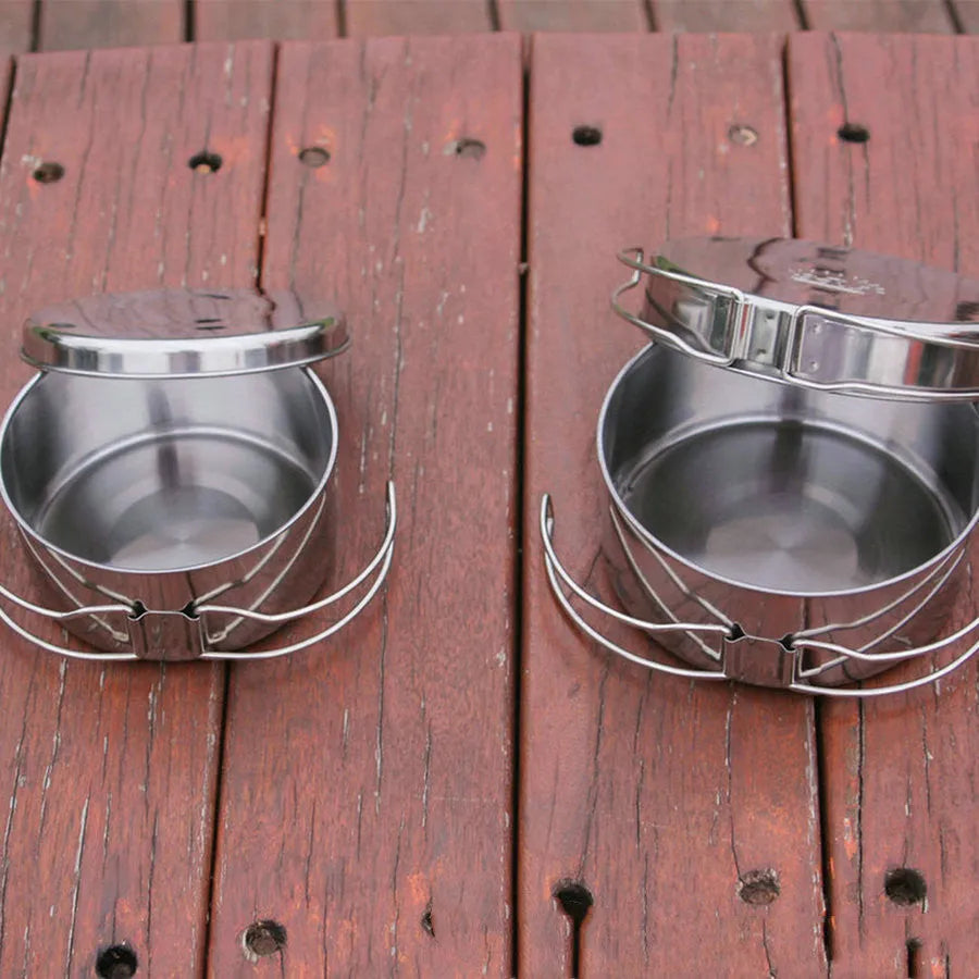 Silver stainless steel camping cookware set with 4 round pots for outdoor cooking