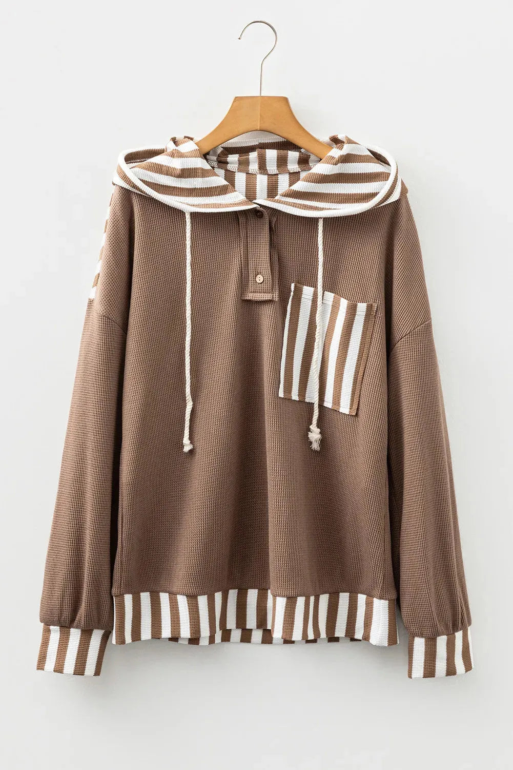 Straw yellow women's hoodie with waffle texture and striped patchwork design, featuring a button neck and drawstring waist.