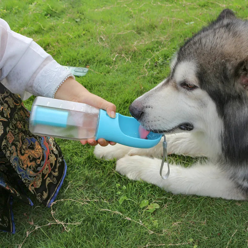 Portable 3-in-1 pet water bottle with 600ml capacity, leak-proof drinker, and poop dispenser in pink
