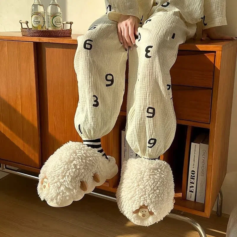 Women's winter cartoon sheepskin cotton slippers with wool lining and PVC non-slip outsole, black and white sheep design