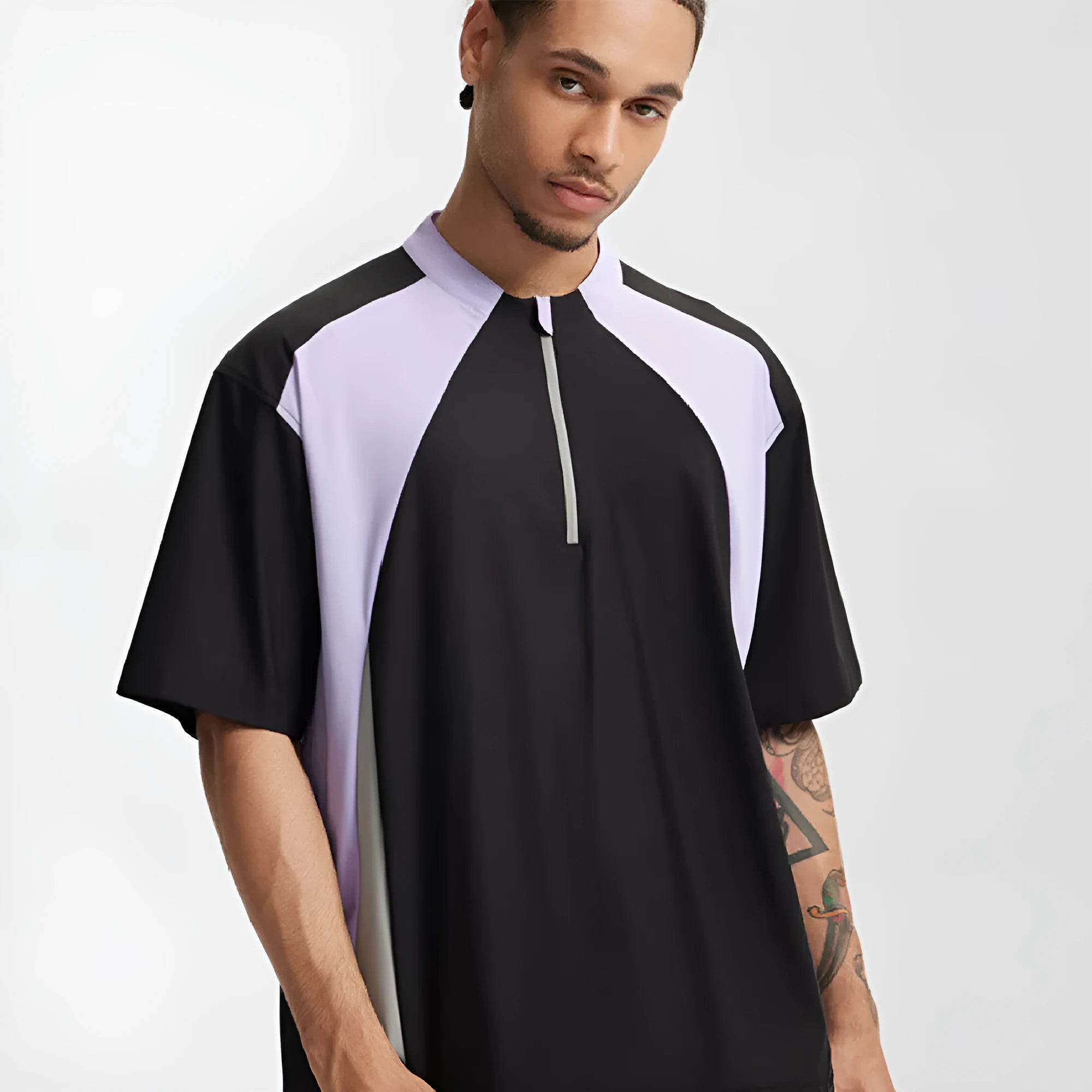 Men's solid colour polyester top with stitching detail, shown in black and beige with long and short sleeve options.