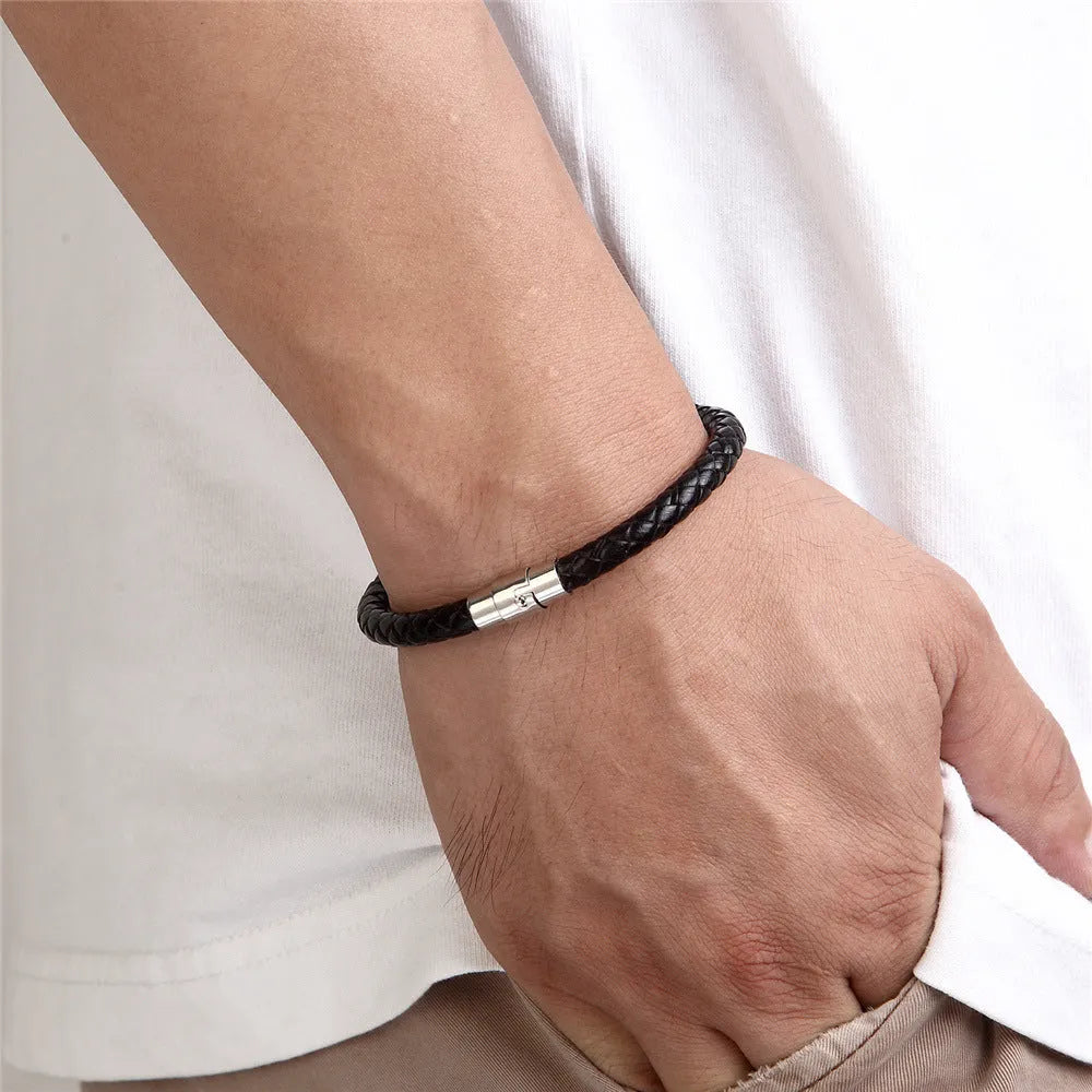 Geometric titanium steel wire bracelet with magnetic clasp on a wrist, shown in a matte grey finish.