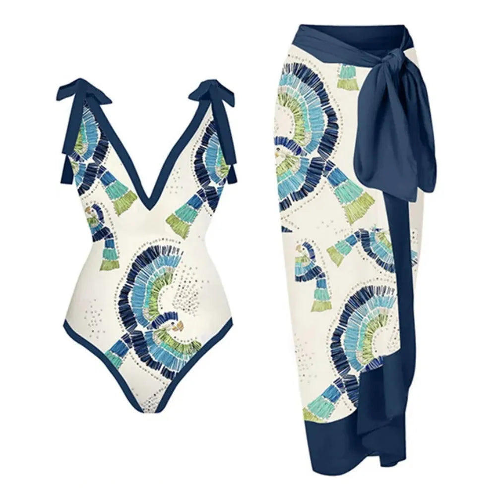 Blue French retro one-piece swimsuit with matching gauze skirt on a mannequin, backless design.