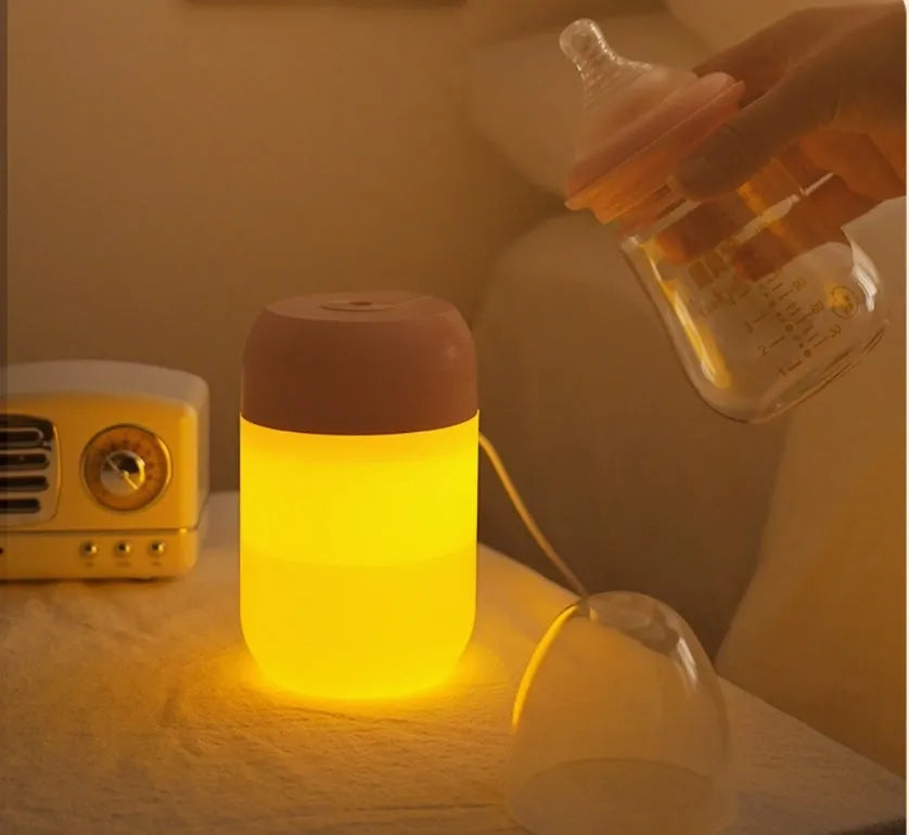 Small white cylindrical USB humidifier for desktop aromatherapy and humidification.