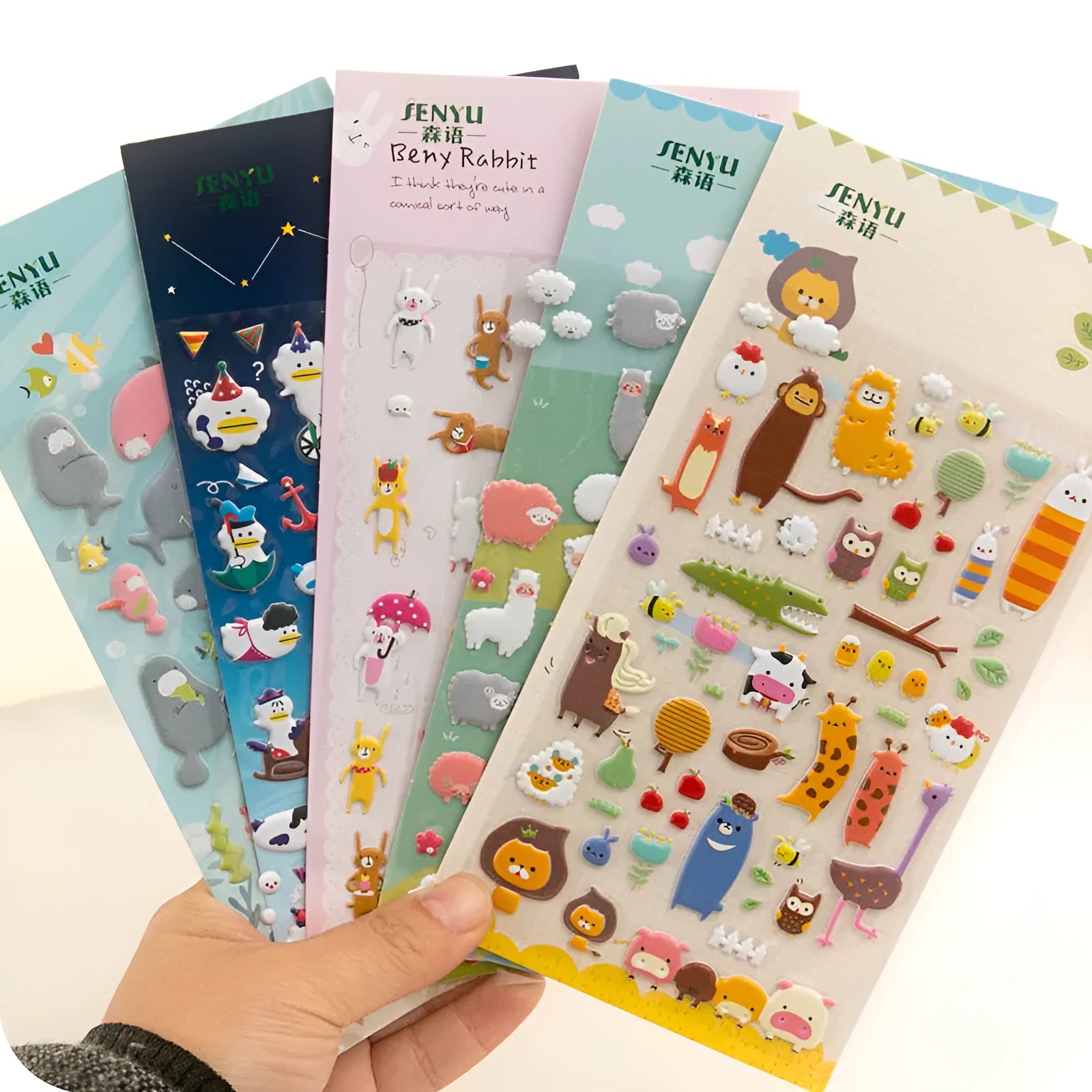 Pack of colourful 3D bubble stickers showing raised cartoon designs of an alpaca, cat, dinosaur, and sweetheart motifs.
