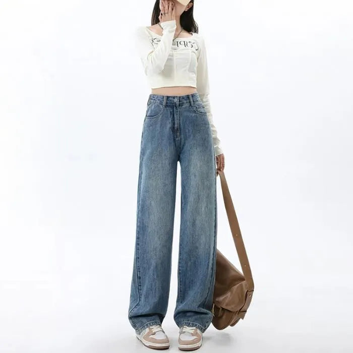 Women's retro blue high-waisted wide-leg denim jeans on a hanger, showing the straight-leg cut.