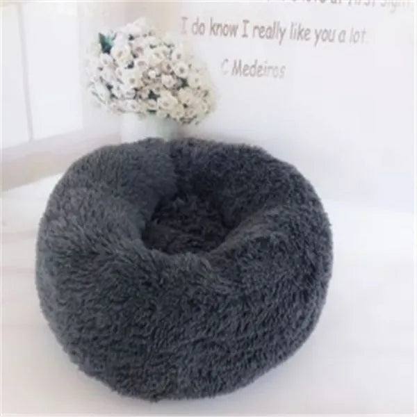 Round long hairy cat bed in plush fabric with anti-slip bottom for autumn and winter