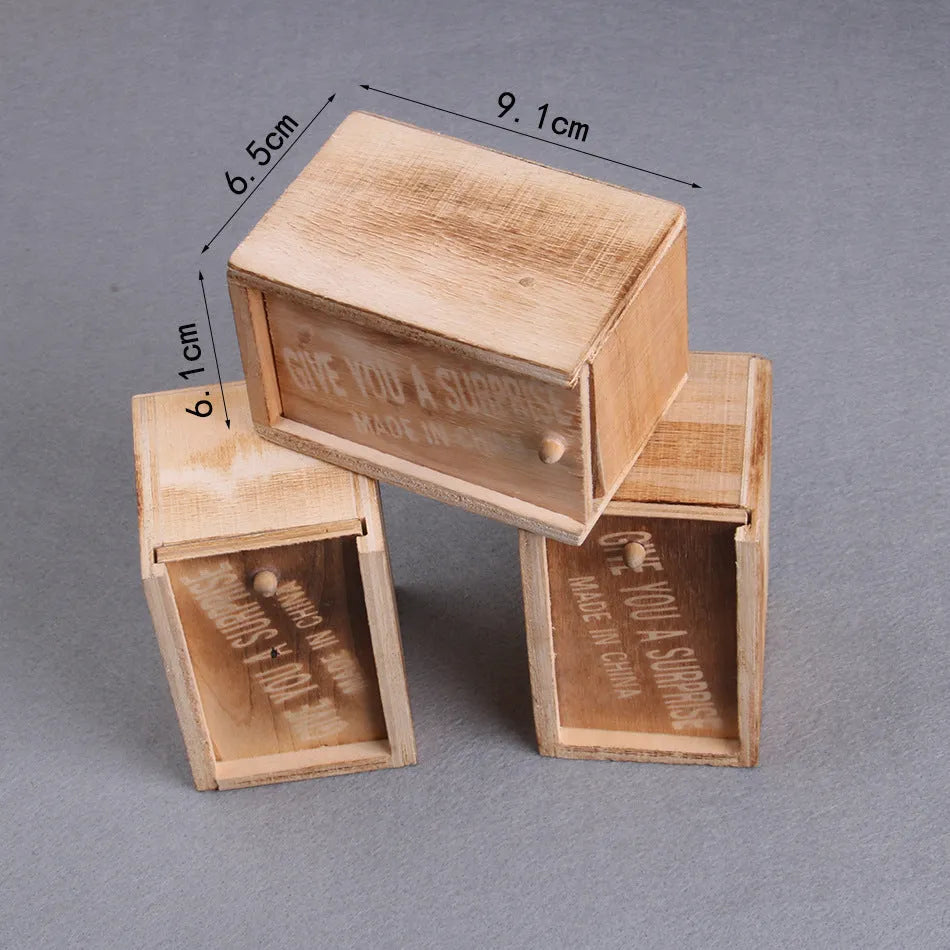 Wooden prank box with jumping scorpion, gecko or mouse for April Fools jokes