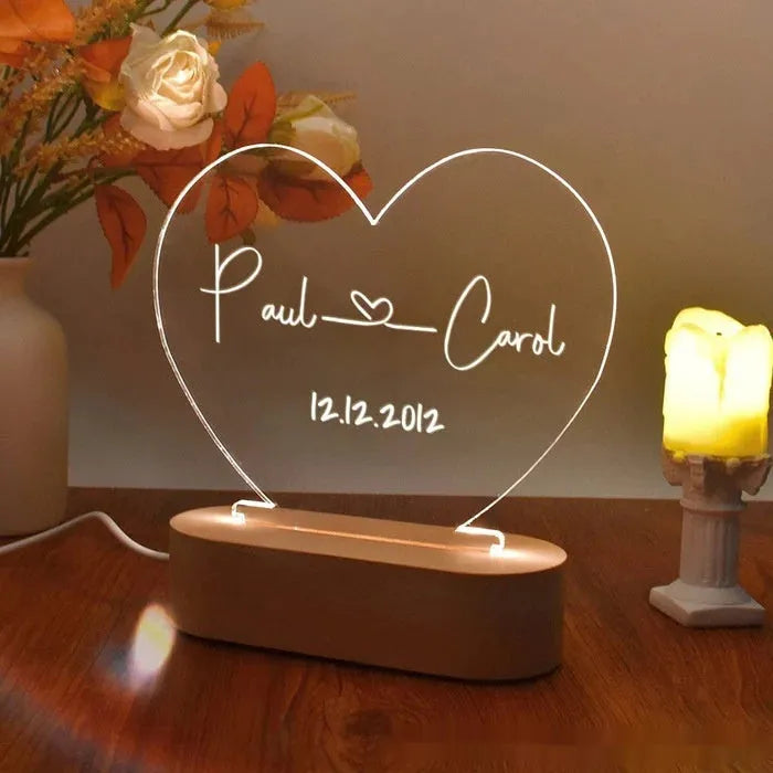 Custom transparent acrylic LED night light with personalised names and date engraving.