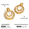 A pair of round, golden, hollow double layer stud earrings made from titanium steel with 18K gold electroplating.