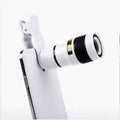 12x magnification phone telescope with adjustable clip attached to a mobile phone for long-distance viewing.