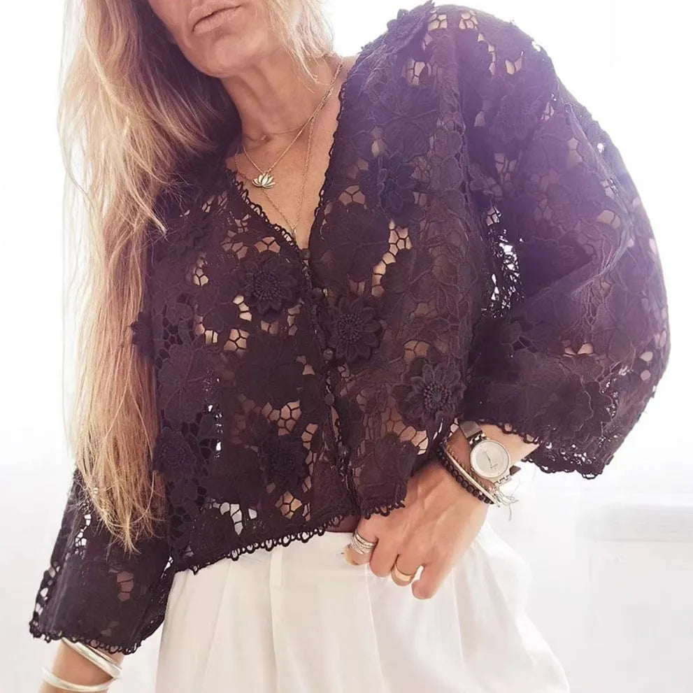 Loose fit lace cardigan with V-neck, long sleeves, and a 3D hollow flower decoration in black colour.