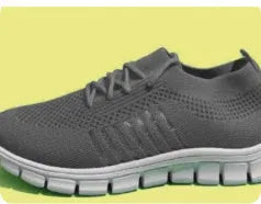 Women's casual flying knit mesh sports flat shoes in a light colour with front lace-up design.