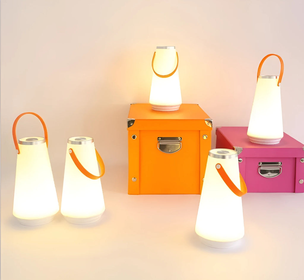 White rechargeable LED night light with touch controls measuring 12x12x22cm