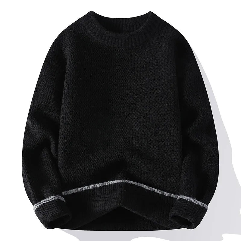Man wearing a grey loose-fit round neck men's pullover sweater.