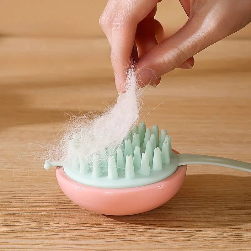 Silicone pet bathing brush with soft bristles and ergonomic handle in blue, pink, white, or yellow colours