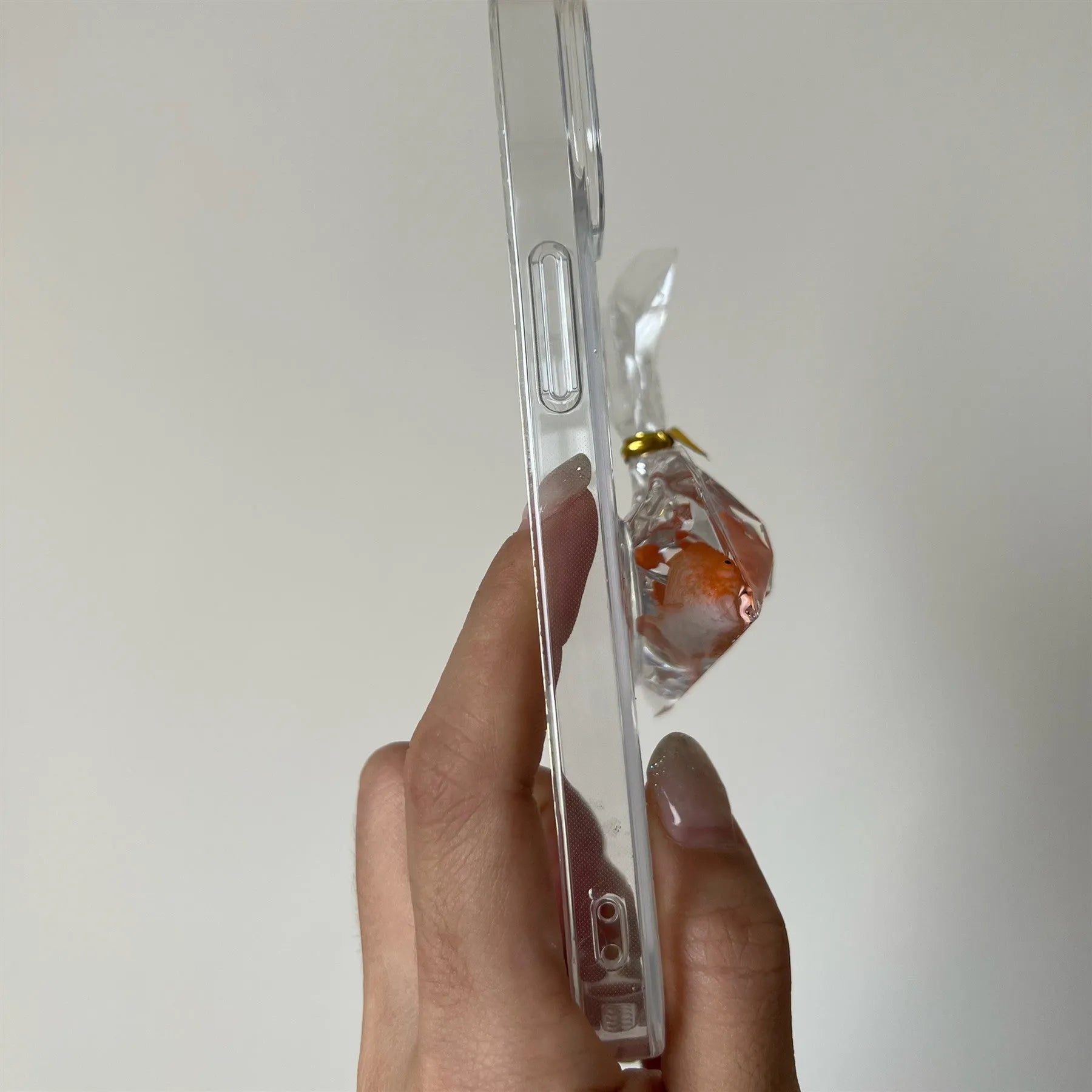 Transparent 3D fish water bag phone case for iPhone showing cartoon fish design