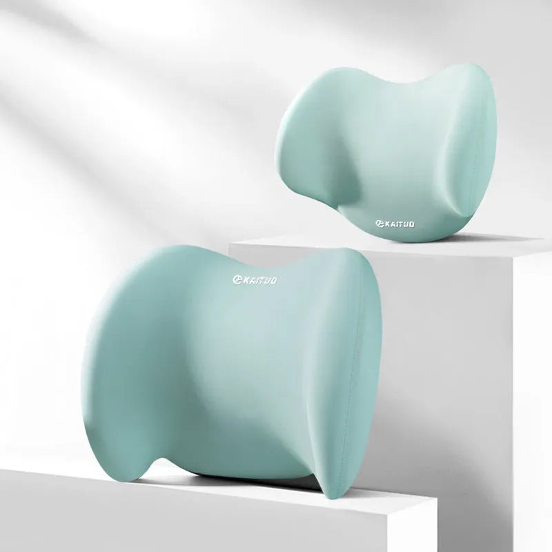 Grey geometric-patterned memory foam car headrest pillow and lumbar support pillow on a car seat.