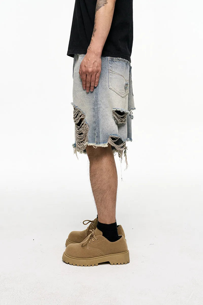 Light blue retro washed men's baggy denim shorts on a mid-rise mannequin, showing wide-leg cut.