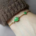 Yellow gold electroplated women's bracelet with retro style design on simple background