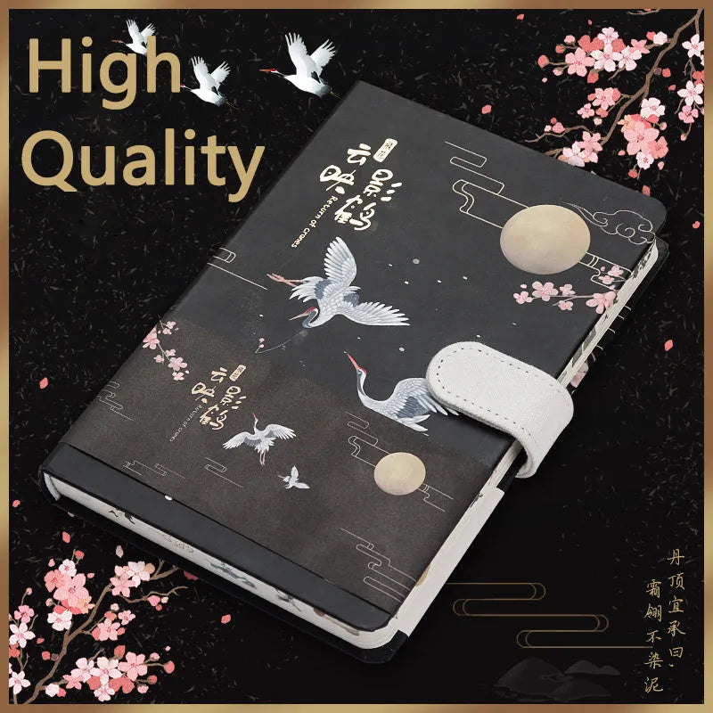 A5 wire-bound retro notebook open showing full-colour vintage illustrations, with a pen.