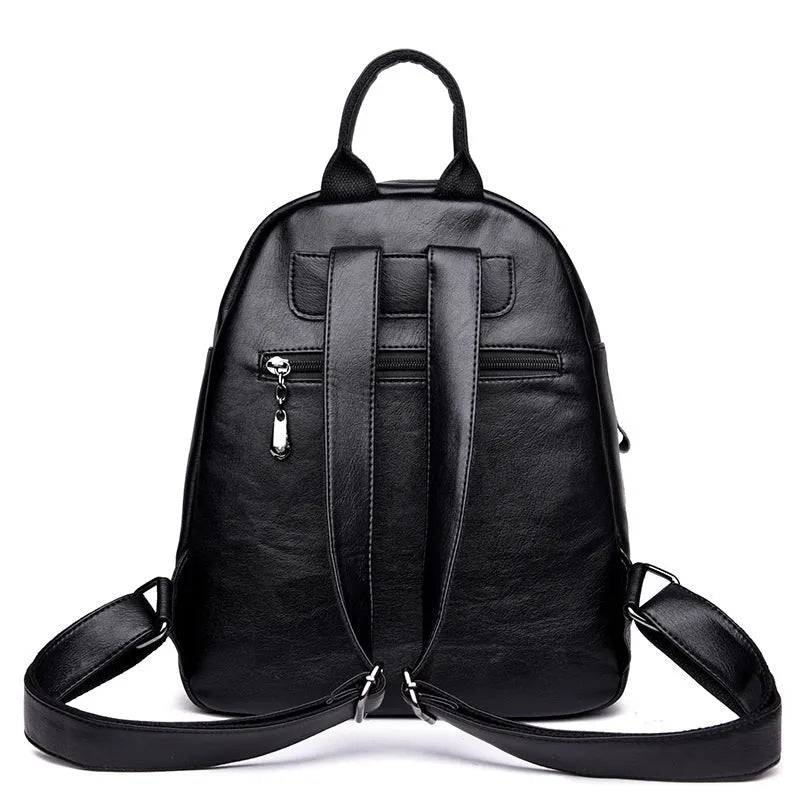 Ladies PU backpack in colour block design with zip pockets and document bag, vertical square shape, black blue or red.