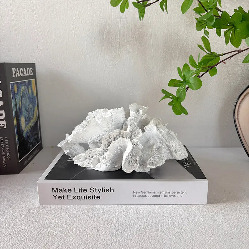 Off-white geometry coral ornament made from synthetic resin on a shelf