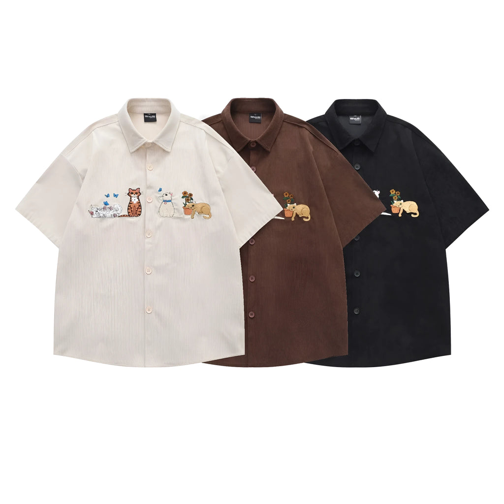 Loose apricot cardigan shirt with cartoon embroidery detail on the front