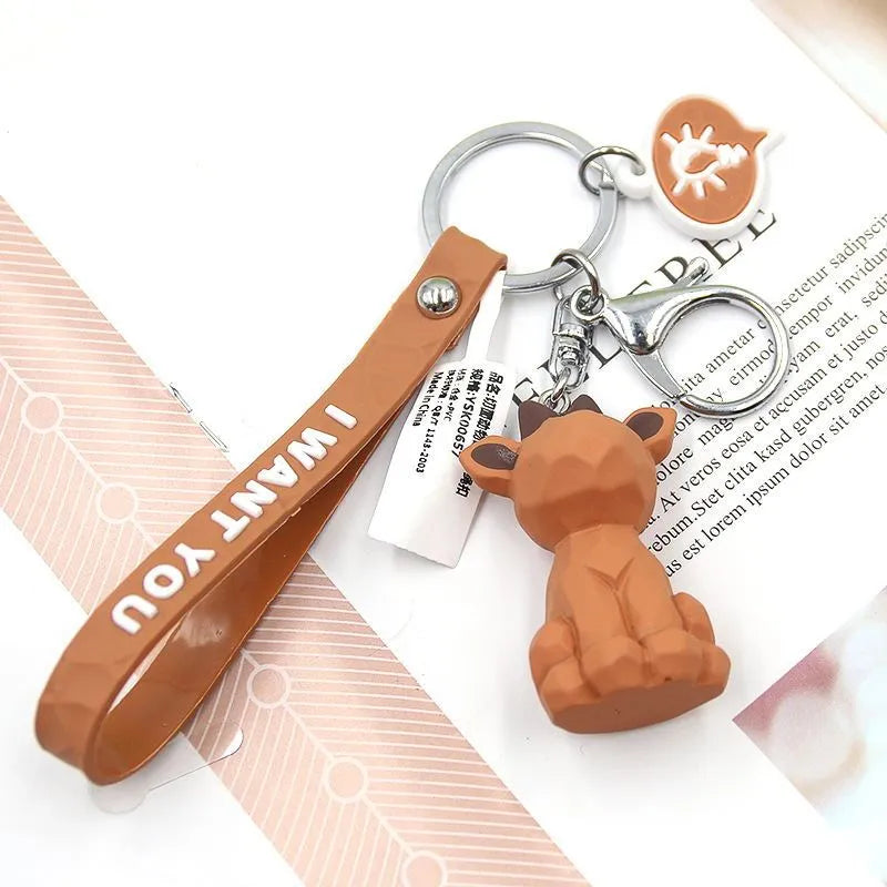Acrylic geometric animal keychain in dinosaur style with colour buckle detail on a key ring