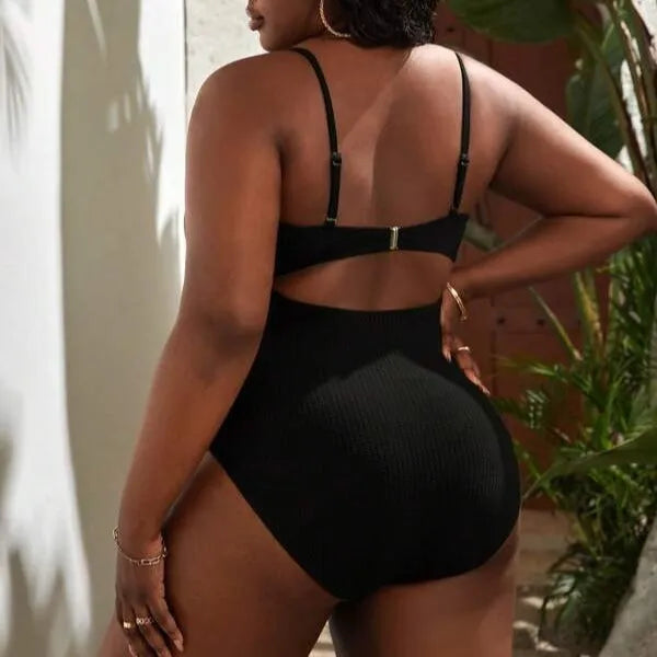 Black plus size women's slimming one-piece swimsuit with sleeveless triangle style design