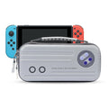 Nintendo Switch OLED portable storage handbag in black showing console and game cartridge organisation