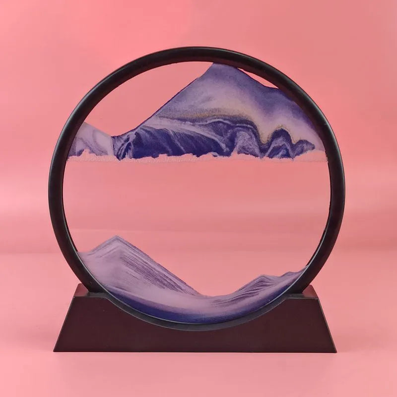 3D dynamic sand painting in glass frame with shifting blue and purple sand patterns