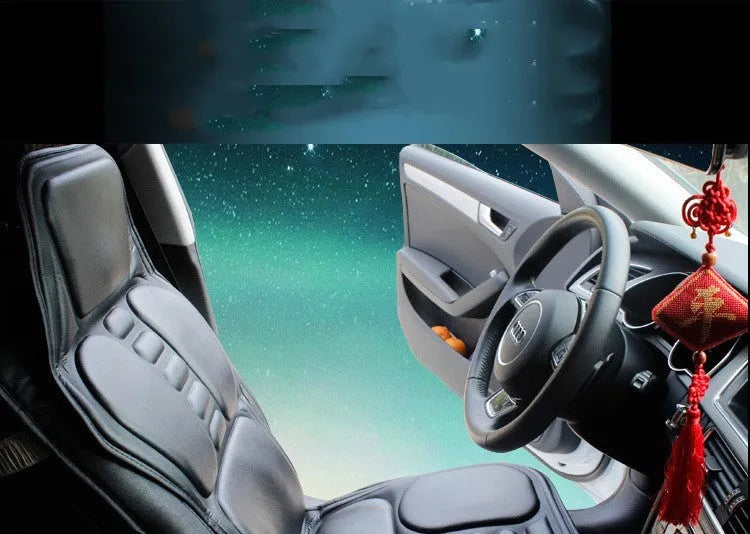 Black car massager with deep massage head and heating function for neck and waist relief on a car seat