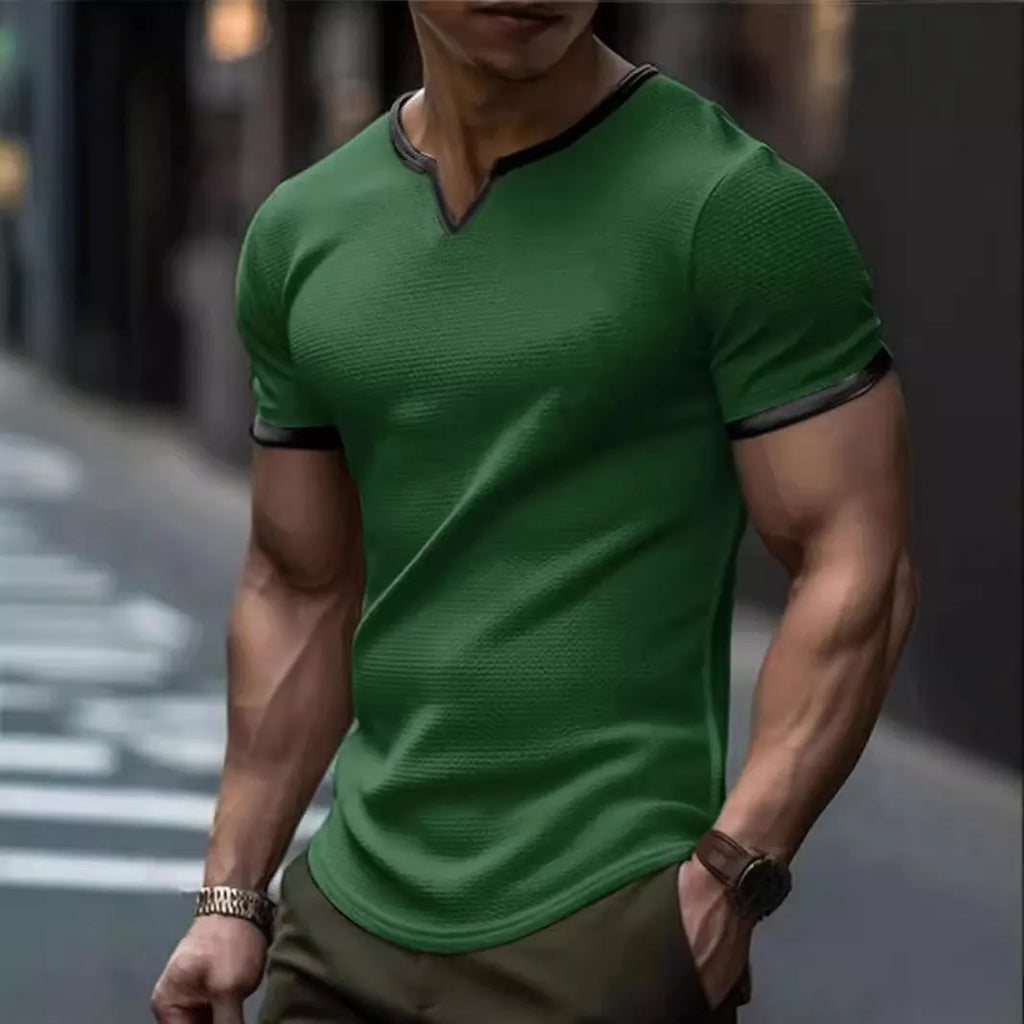 Colour-block waffle textured V-neck sports t-shirt in polyester on a size chart.