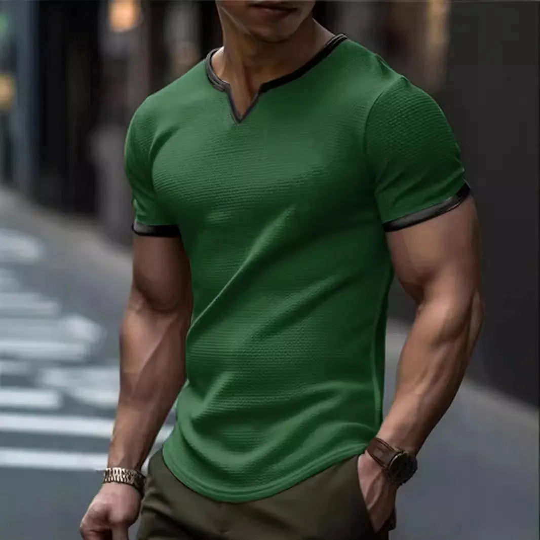 Colour-block waffle textured V-neck sports t-shirt in polyester on a size chart.