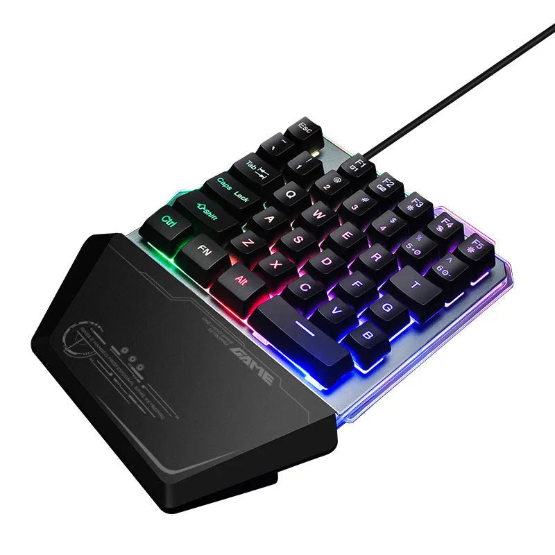 G40 Flow black one-handed mechanical keyboard with RGB backlit keys on a desk