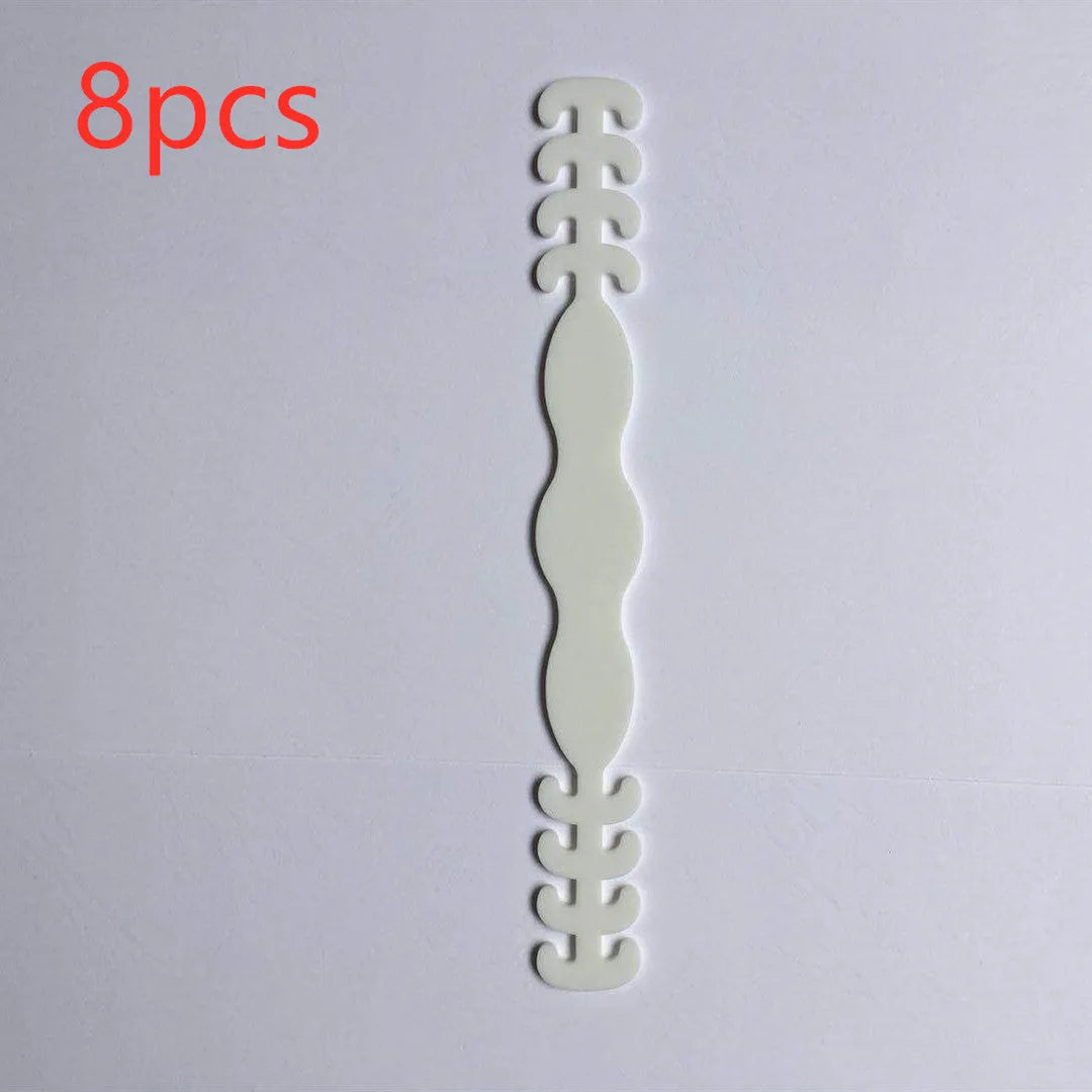 Eight silicone tool buckles in red, yellow, black, white, violet, pink, blue, and green colours.