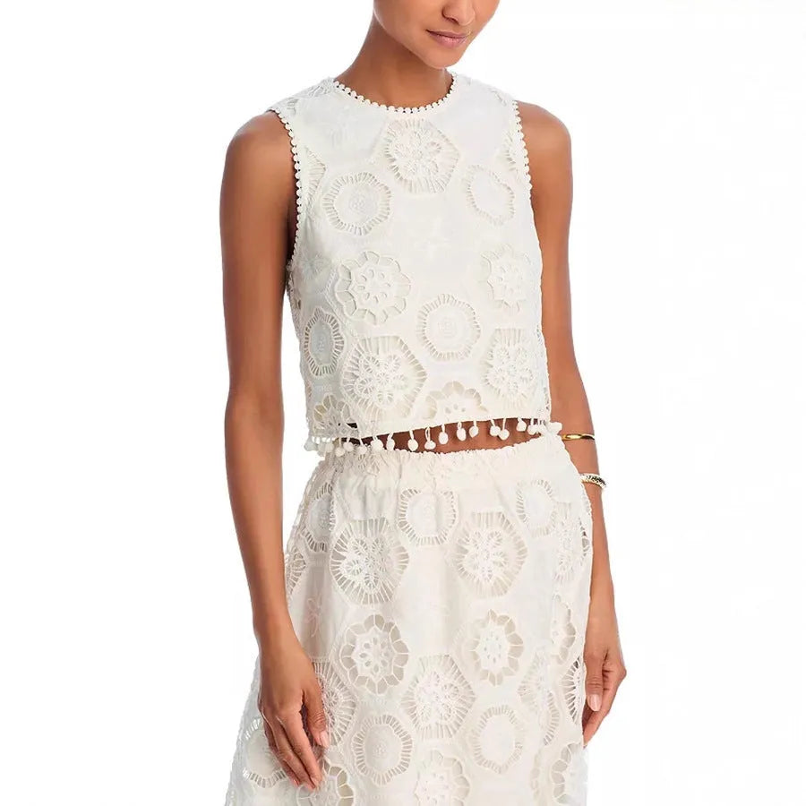 Literary Trends white women's suit set with sleeveless top and embroidered long skirt on a hanger.
