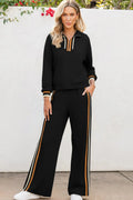 Black striped patchwork quarter zip pullover and loose trousers set on a model