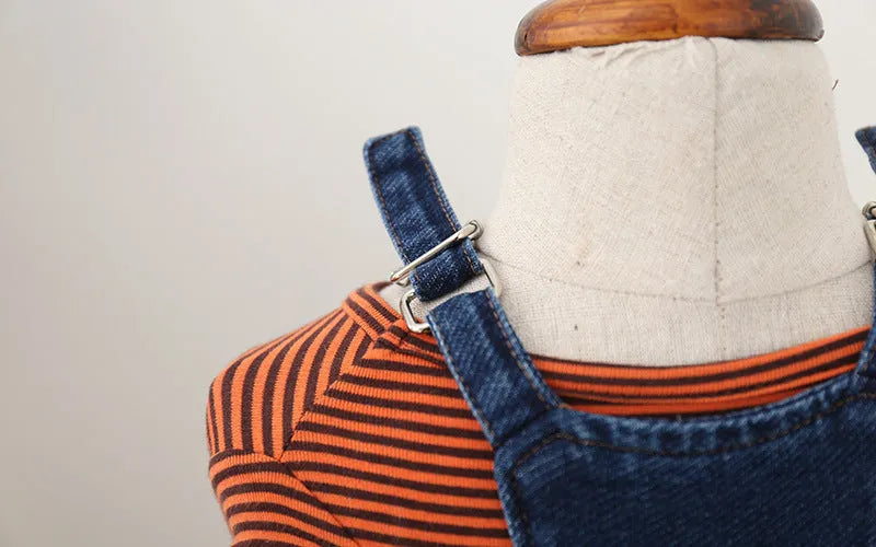 Jeans-style four-legged dog clothes in cotton, dark colour, on a small dog breed like Teddy