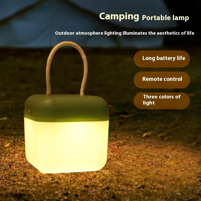 LED hanger solid color portable rechargeable light in green with remote control on a table