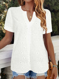 White women's V-neck t-shirt with a hollow-out pattern on the front, showing a loose, casual fit.