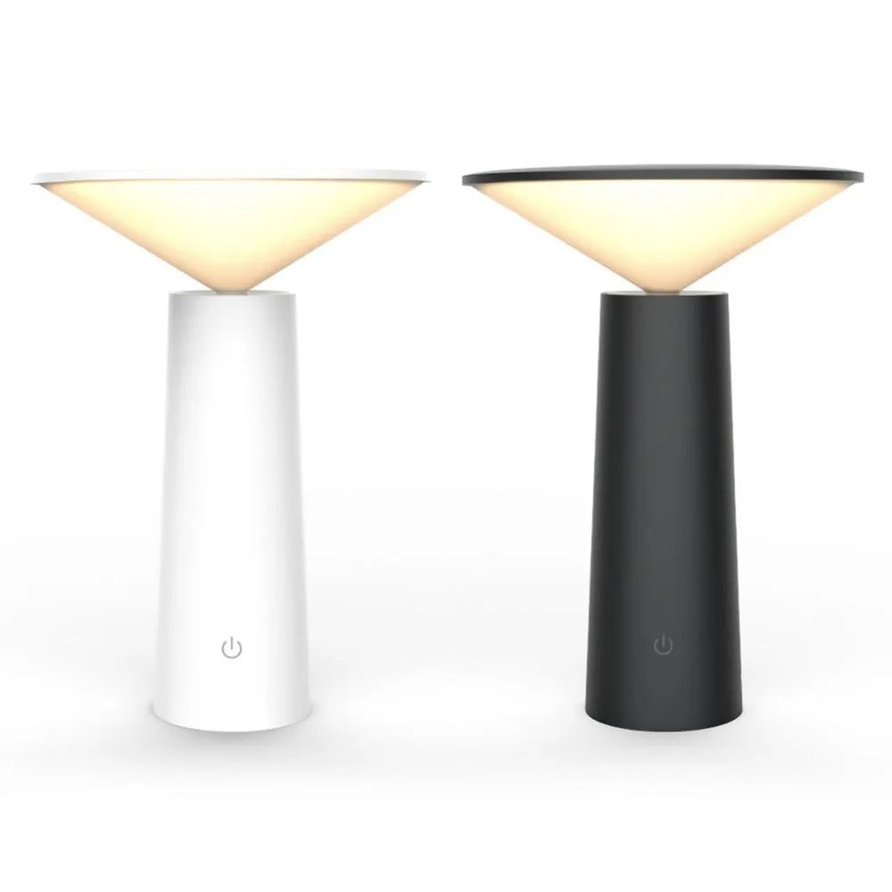 Black USB rechargeable LED desk lamp with touch sensor and adjustable lamp head on a wooden desk.