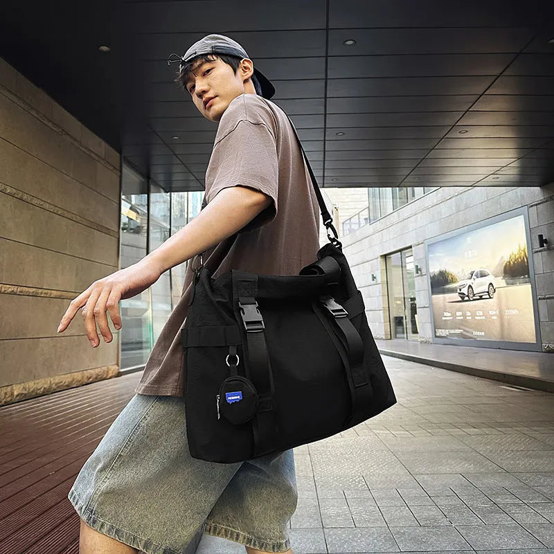 Men's large capacity shoulder travel bag in black colour with organisational compartments