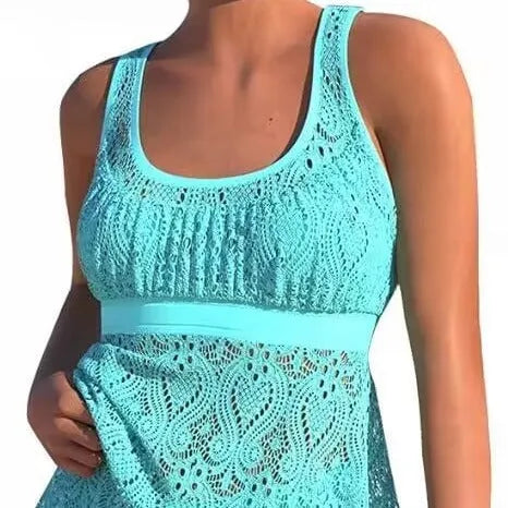 Women's solid colour conservative split two-piece swimsuit with sleeveless top and briefs.