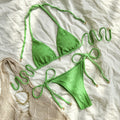Women's halter neck lace-up bikini swimsuit in polyester fabric available in milky white, green, and white colours