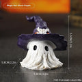 Purple and black resin wizard hat and ghost holiday ornaments.
